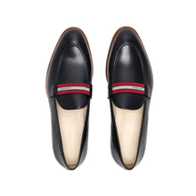 Load image into Gallery viewer, Top-down view of luxurious black calf loafers with a web stripe band, highlighting the meticulous stitching and craftsmanship on a white surface.