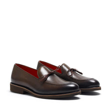 Load image into Gallery viewer, A pair of olive-green leather loafers featuring a lace-up front, a low block heel, and a sleek silhouette, presented on a pure white background.