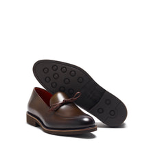 Load image into Gallery viewer, Angled view showcasing the profile of an olive calf laced loafer with its rubber outsole and stacked heel, against a white background.