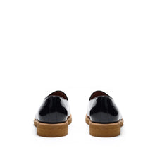 Load image into Gallery viewer, Back view of glossy patent black belgian loafers highlighting the sturdy heel construction with a tan sole, contrast stitching, and a polished finish.