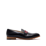 Side profile of a chic black calf leather loafer featuring a web stripe accent and a natural leather sole, presented against a pure white backdrop.