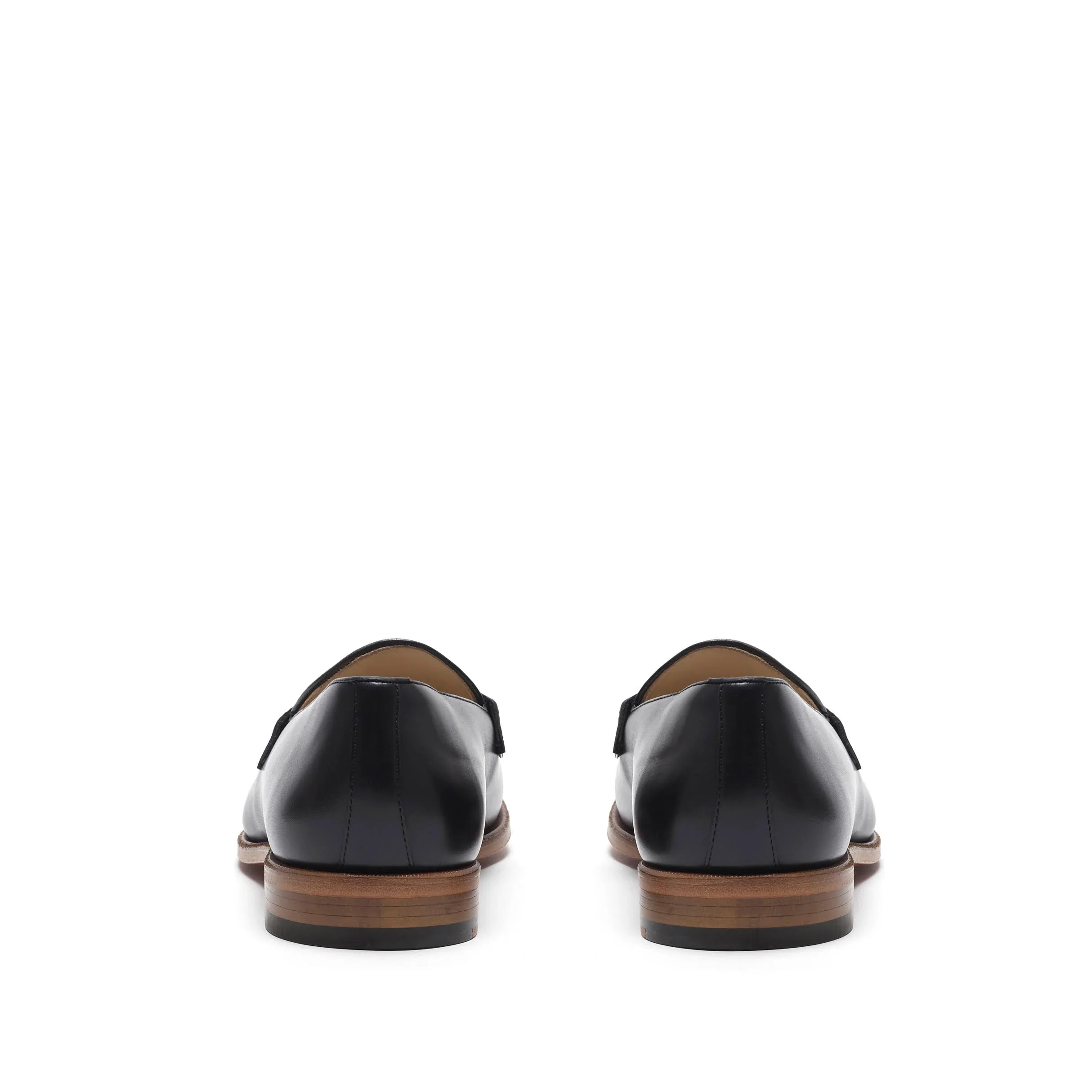 Back perspective of sophisticated black calf loafers, emphasizing the heel design and leather sole, set against a white background.