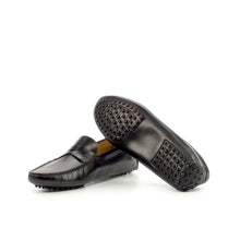 Load image into Gallery viewer, An image displaying the unique pebbled sole of a black nappa leather penny driving loafer, highlighting the rubber nubs for grip and comfort.
