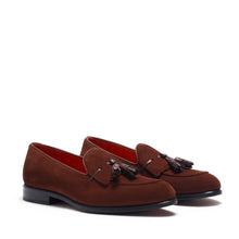 Load image into Gallery viewer, Front view of brown suede kiltie tassel loafers with a polished black outsole, elegantly presented against a white backdrop.
