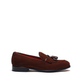 Side perspective of the brown suede loafers showing off the classic Kiltie tassel detail and sleek profile on a white background.