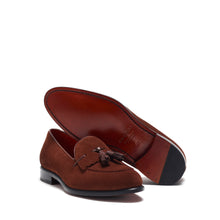 Load image into Gallery viewer, Angled view displaying the brown suede loafers with a visible black outsole and a glimpse of the cognac outsole bottom edge.
