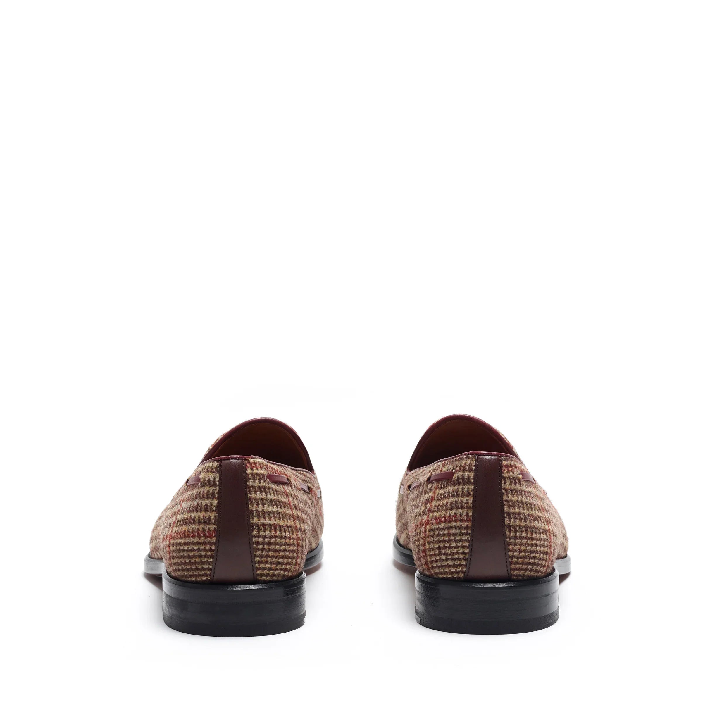 Back view of the loafers, displaying the fine stitching detail and contrast between the tweed and the dark sole.