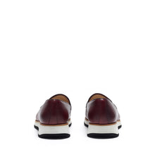 Load image into Gallery viewer, Back angle of the loafers highlighting the dark heel counter and the gentle slope of the shoe&#39;s back, all above a sturdy chunky sole.
