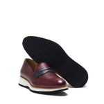 Angled perspective revealing the multi-layered chunky sole with non-slip tread, complementing the grained burgundy upper.