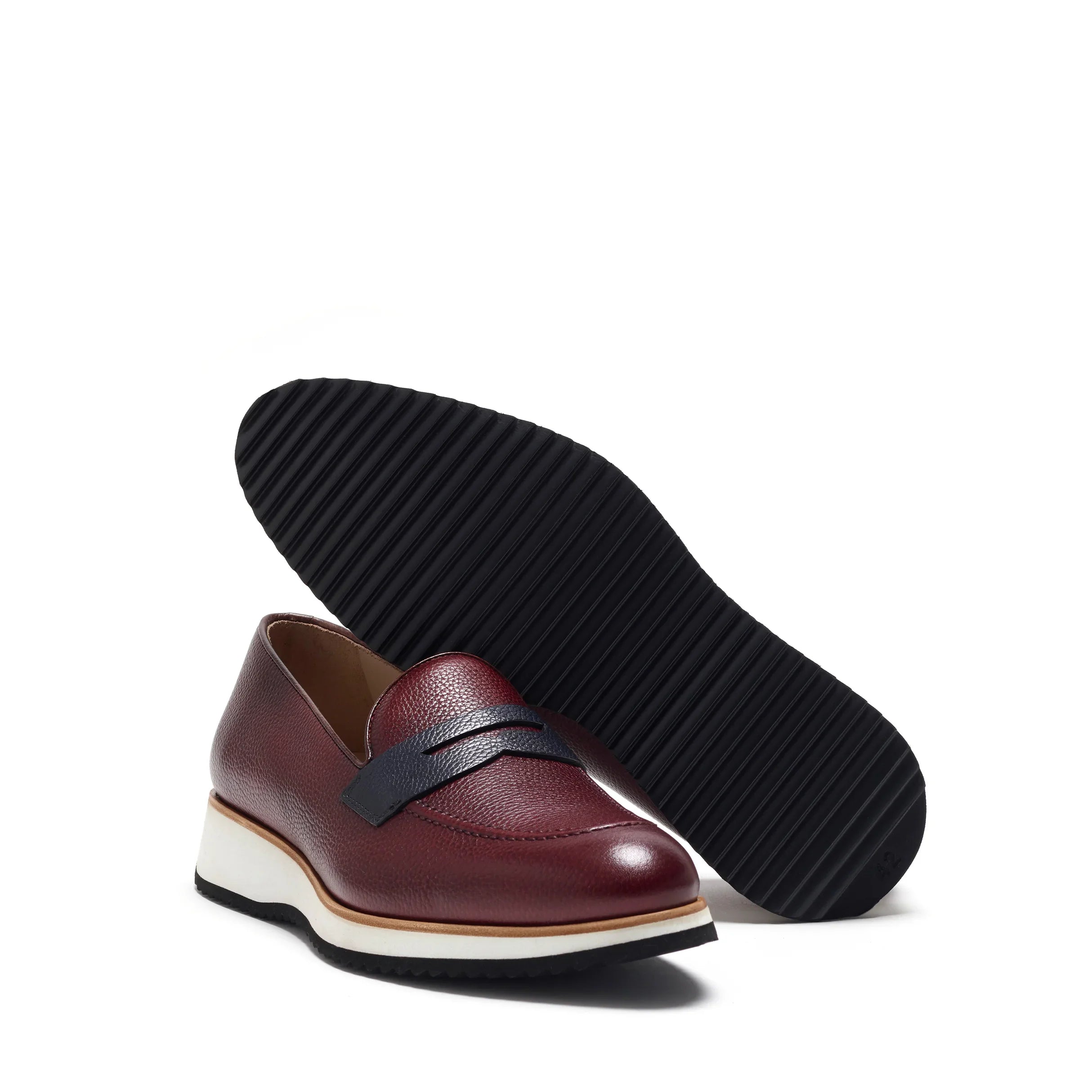 Angled perspective revealing the multi-layered chunky sole with non-slip tread, complementing the grained burgundy upper.