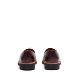 Back angle of the loafers, focusing on the stitching details and the contrast of the burgundy leather and brown heel.