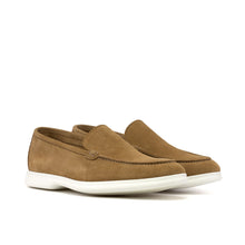 Load image into Gallery viewer, A pair of camel suede casual loafers displayed from a front angle, featuring a smooth suede finish and contrasting white soles, set against a white background.
