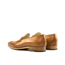 Load image into Gallery viewer, Side view of high-quality cognac shell cordovan penny loafers showcasing the fine stitch detail and robust heel.
