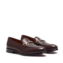 Load image into Gallery viewer, Elegant dark brown calf leather horsebit loafers with a luxury finish and gold-tone horsebit detail, showcased from a front-facing angle, highlighting the sleek design and rounded toe.
