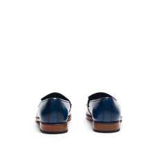Load image into Gallery viewer, Back perspective of the navy fringe loafers, focusing on the heel counter and the clean lines of the shoe&#39;s design.
