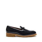 Side view of a patent black Belgian loafer showing the profile of the high-shine upper and the natural-tone leather sole edge.