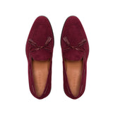 An overhead view showcasing the deep wine suede upper of the loafers, complemented by the burgundy calf leather laced tassels, creating a refined aesthetic.