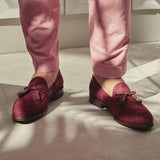 The loafers worn in a lifestyle setting, accentuating the laced tassel detail and showcasing how they complement a casual, chic style.