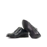 Green crocodile-patterned dress shoes on a white background