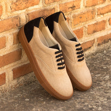 Load image into Gallery viewer, A pair of Beige &amp; Black Linen Top-Sider Trainers by ADORSI leaning against a brick wall.
