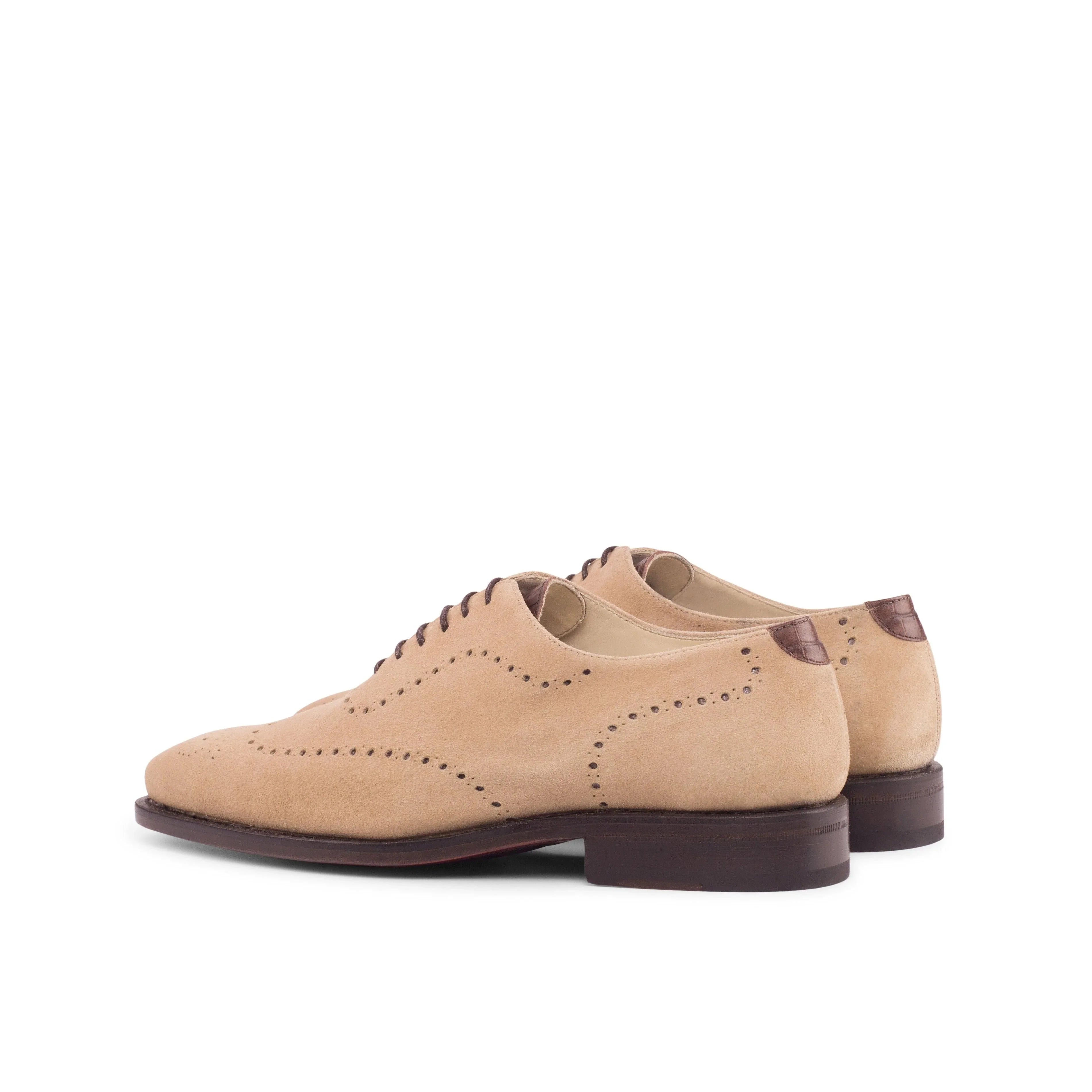 A pair of beige suede wholecut shoes by ADORSI on a white background.