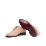 A pair of Beige Suede Wholecut Shoes by ADORSI on a white background.