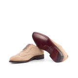 A pair of Beige Suede Wholecut Shoes by ADORSI on a white background.